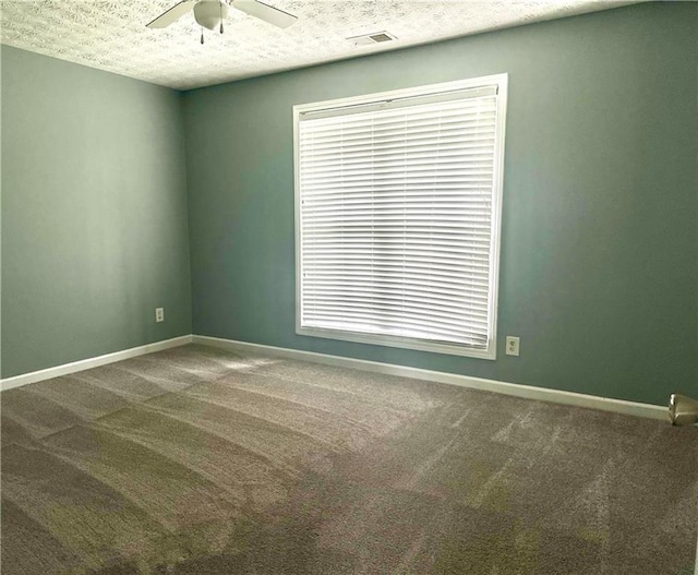 10175 Hemlock Way, Jonesboro, GA 30238 - carpeted empty room with a textured ceiling, ceiling fan, and baseboards