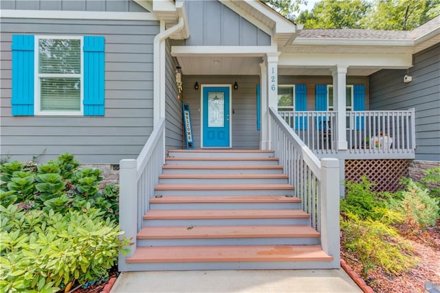 doorway to property featuring covered porch