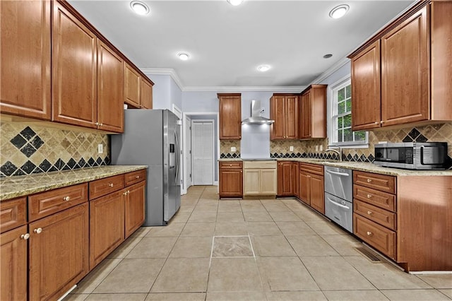1920 Lee Patrick Dr, Dacula, GA 30019 - kitchen featuring stainless steel appliances, ornamental molding, wall chimney exhaust hood, decorative backsplash, and brown cabinets