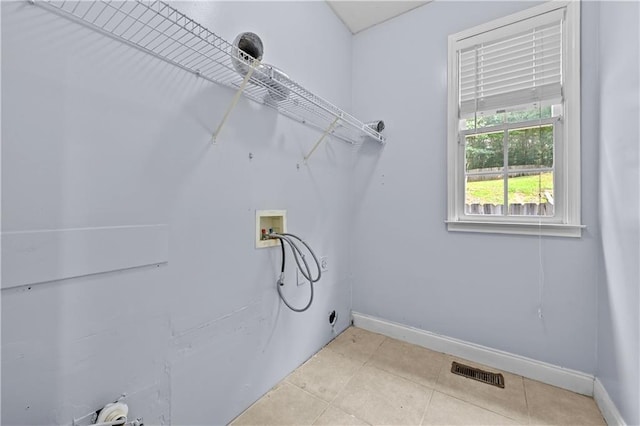 1920 Lee Patrick Dr, Dacula, GA 30019 - washroom featuring washer hookup, baseboards, and light tile patterned floors