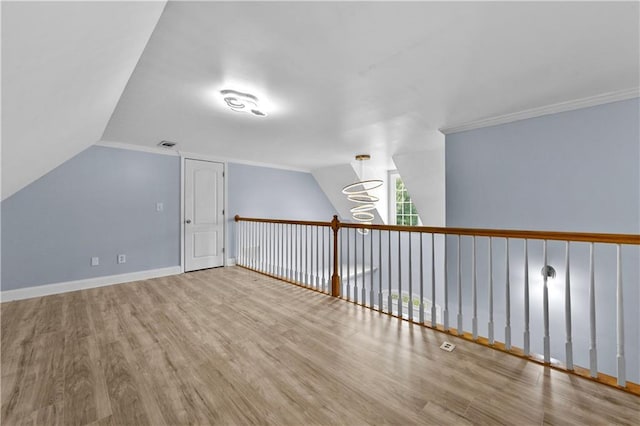 1920 Lee Patrick Dr, Dacula, GA 30019 - additional living space with wood finished floors, vaulted ceiling, and baseboards