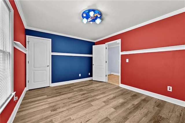 1920 Lee Patrick Dr, Dacula, GA 30019 - unfurnished bedroom featuring baseboards, wood finished floors, and crown molding