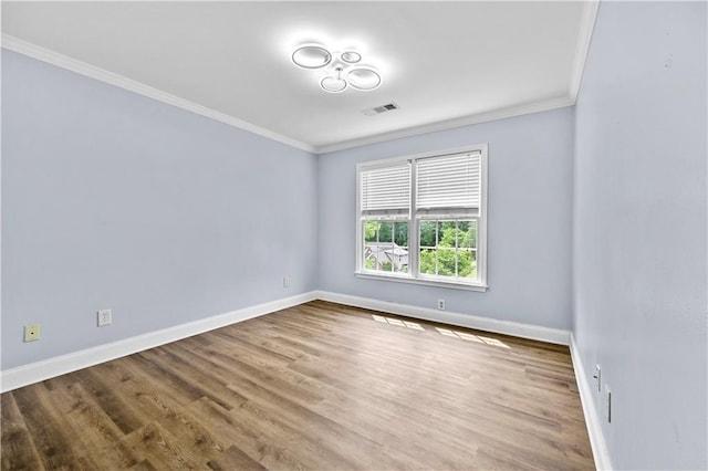 1920 Lee Patrick Dr, Dacula, GA 30019 - spare room with crown molding, baseboards, and wood finished floors