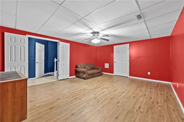 1920 Lee Patrick Dr, Dacula, GA 30019 - unfurnished room with a ceiling fan, a drop ceiling, light wood-type flooring, and baseboards