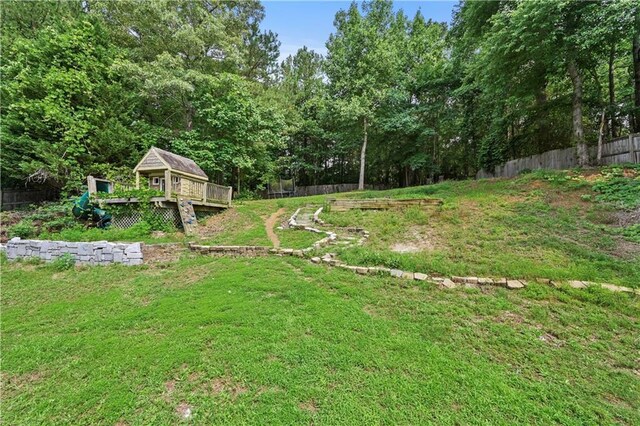 1920 Lee Patrick Dr, Dacula, GA 30019 - view of yard featuring a deck