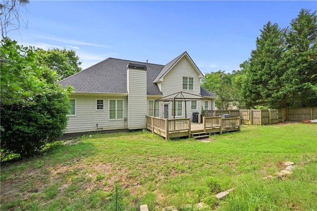 1920 Lee Patrick Dr, Dacula, GA 30019 - back of property featuring a deck and a shingled roof