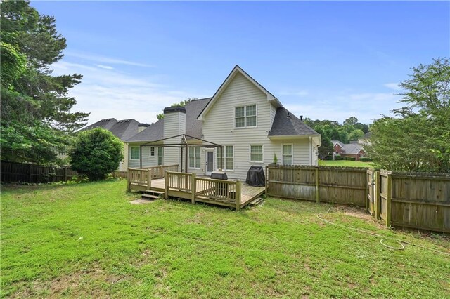 1920 Lee Patrick Dr, Dacula, GA 30019 - rear view of property with a wooden deck and roof with shingles