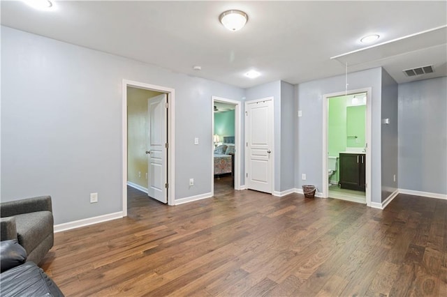 4746 Highland Ave, Sugar Hill, GA 30518 - unfurnished living room with attic access and wood finished floors