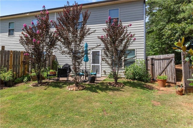 4746 Highland Ave, Sugar Hill, GA 30518 - rear view of house featuring a fenced backyard and a patio area