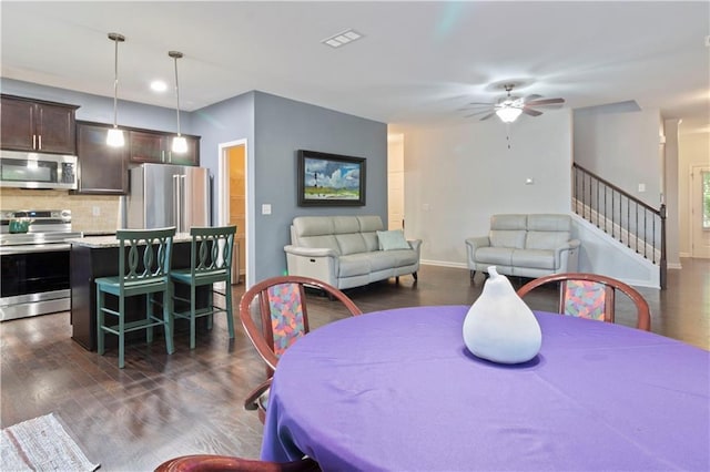 4746 Highland Ave, Sugar Hill, GA 30518 - dining area featuring dark wood-type flooring, a ceiling fan, stairway, and recessed lighting