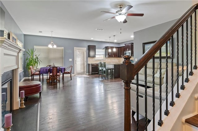4746 Highland Ave, Sugar Hill, GA 30518 - living room featuring a ceiling fan, a fireplace, wood-type flooring, stairs, and recessed lighting