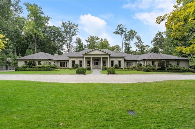 ranch-style house with a front yard