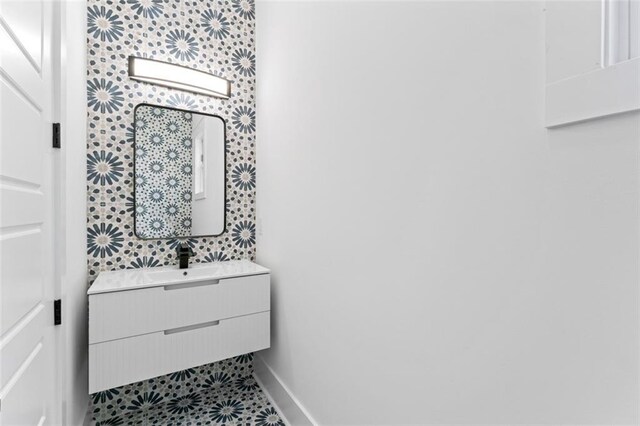 bathroom featuring vanity and baseboards