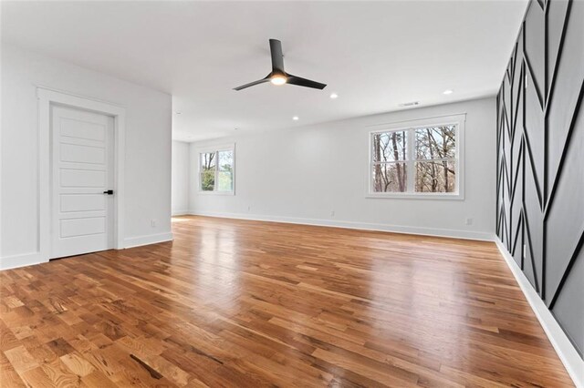 unfurnished room featuring light wood-type flooring, baseboards, visible vents, ceiling fan, and recessed lighting