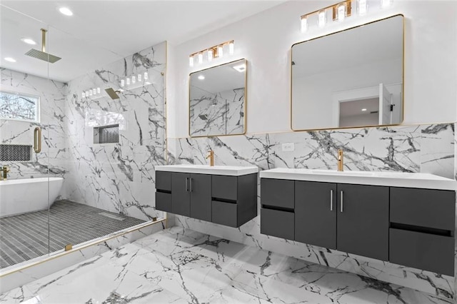 bathroom with a sink, a marble finish shower, recessed lighting, and two vanities