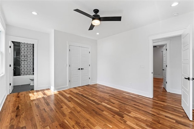 unfurnished bedroom with recessed lighting, baseboards, and wood finished floors