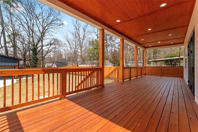 deck with fence and a yard