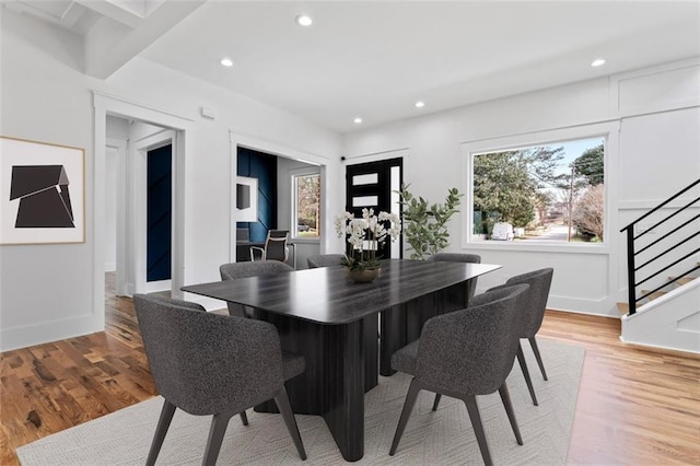 dining area with baseboards, recessed lighting, light wood-style floors, and stairway