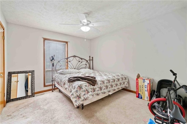 592 Ferry Creek Ct, Acworth, GA 30102 - bedroom featuring carpet, a textured ceiling, and a ceiling fan