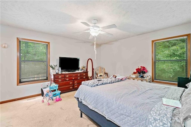 592 Ferry Creek Ct, Acworth, GA 30102 - bedroom featuring carpet floors, a textured ceiling, and ceiling fan