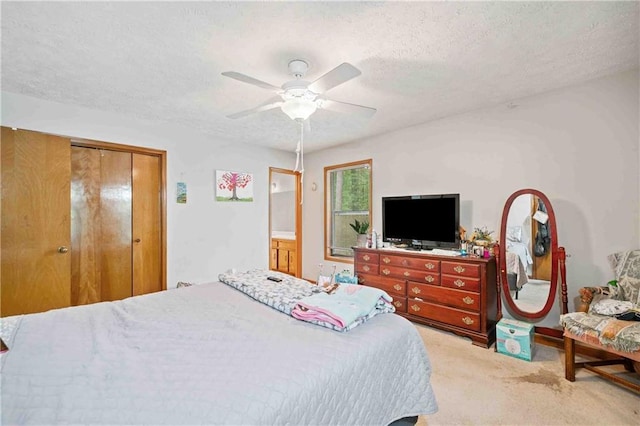 592 Ferry Creek Ct, Acworth, GA 30102 - bedroom featuring light carpet, a textured ceiling, a ceiling fan, and a closet