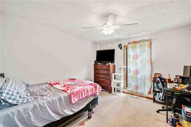 592 Ferry Creek Ct, Acworth, GA 30102 - carpeted bedroom featuring a textured ceiling and a ceiling fan