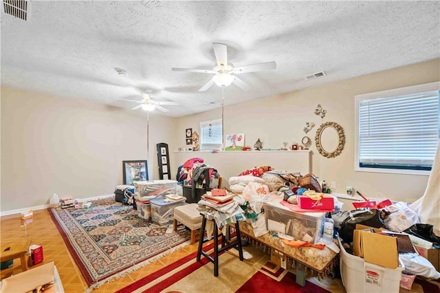 592 Ferry Creek Ct, Acworth, GA 30102 - living room featuring a ceiling fan and a textured ceiling