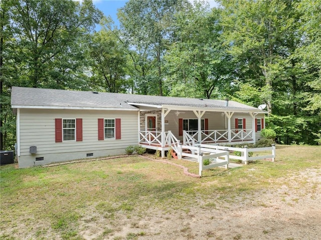 view of front of property with a porch, central AC unit, and a front lawn