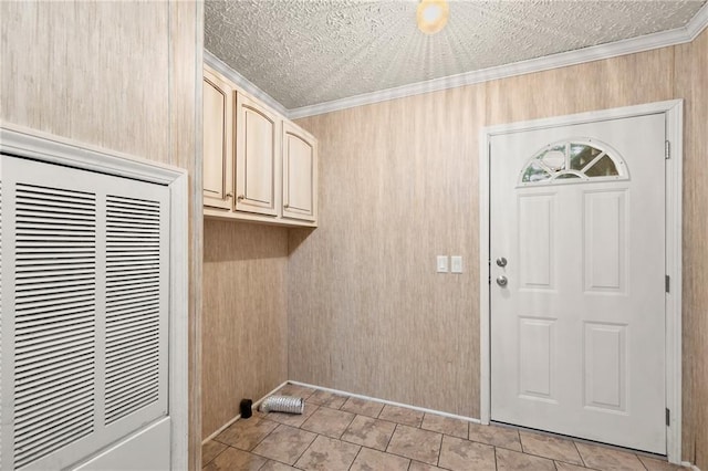 laundry room with crown molding, wooden walls, and a textured ceiling