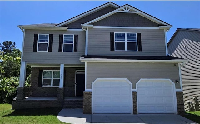 769 Humphry Dr, Winder, GA 30680 - craftsman inspired home featuring covered porch, a garage, concrete driveway, and brick siding