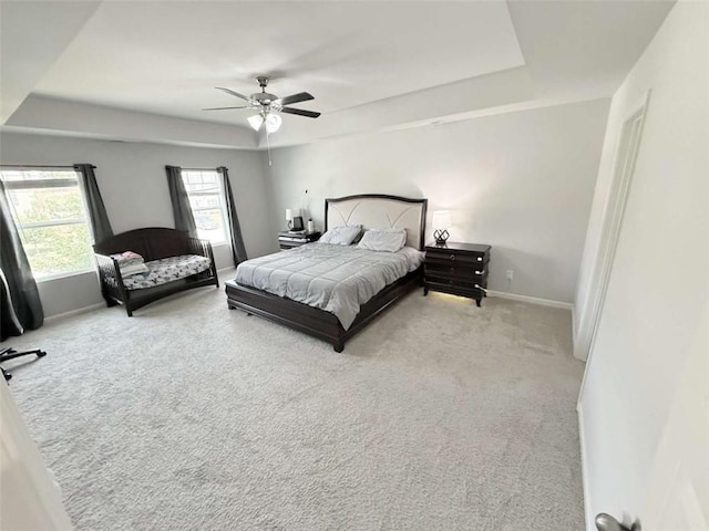 769 Humphry Dr, Winder, GA 30680 - carpeted bedroom with a tray ceiling, baseboards, and a ceiling fan