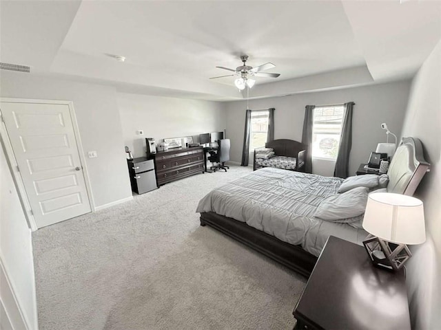 769 Humphry Dr, Winder, GA 30680 - carpeted bedroom featuring a raised ceiling, baseboards, and a ceiling fan