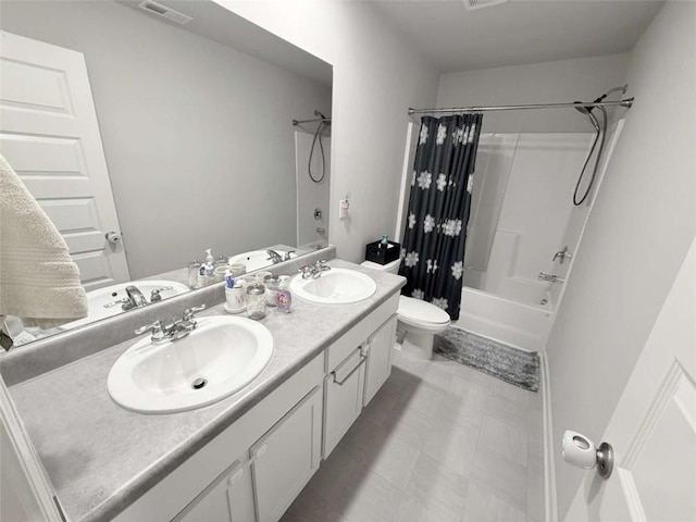 769 Humphry Dr, Winder, GA 30680 - bathroom featuring shower / bath combo, toilet, and double vanity