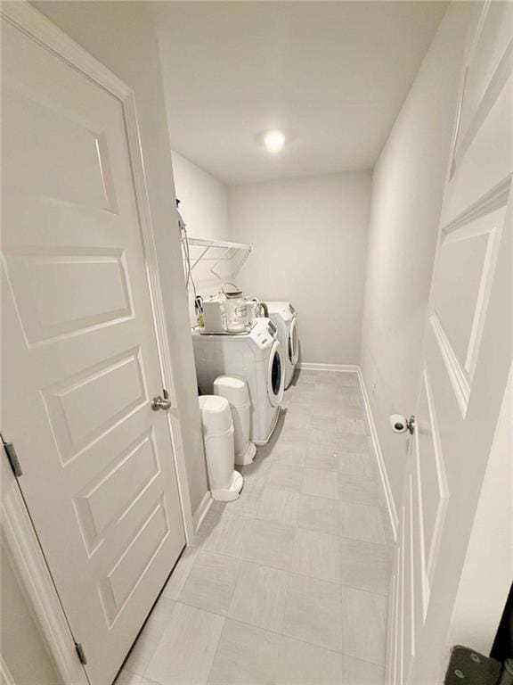 769 Humphry Dr, Winder, GA 30680 - laundry area featuring independent washer and dryer, baseboards, and light floors