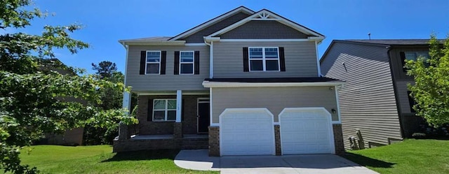 769 Humphry Dr, Winder, GA 30680 - craftsman house with an attached garage, a porch, a front yard, and concrete driveway