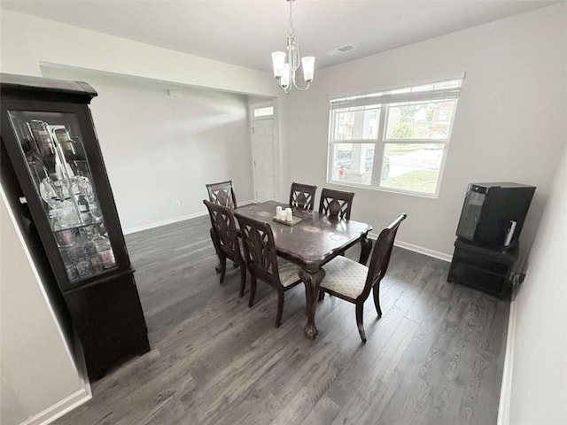 769 Humphry Dr, Winder, GA 30680 - dining space with a chandelier, dark wood-type flooring, and baseboards
