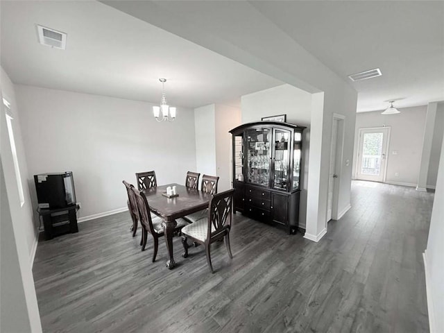 769 Humphry Dr, Winder, GA 30680 - dining area featuring dark wood-type flooring, a chandelier, and baseboards