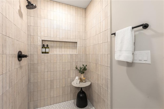 full bathroom with tiled shower