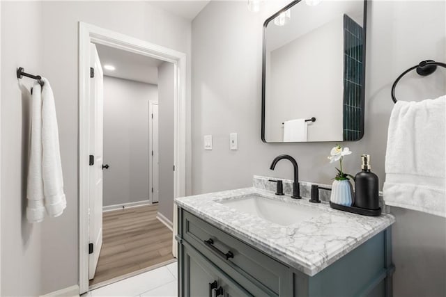 bathroom with baseboards and vanity