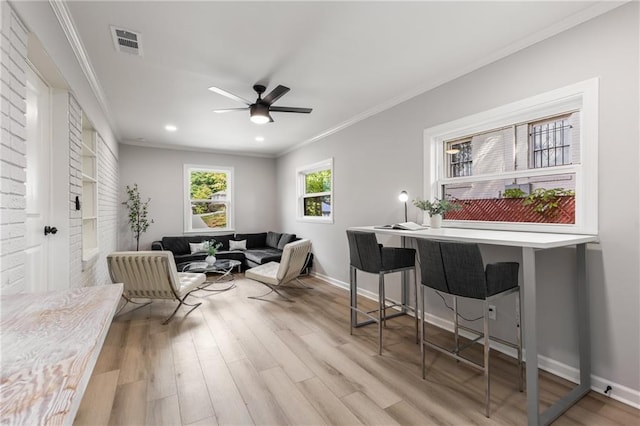 sitting room featuring a ceiling fan, visible vents, wood finished floors, ornamental molding, and recessed lighting
