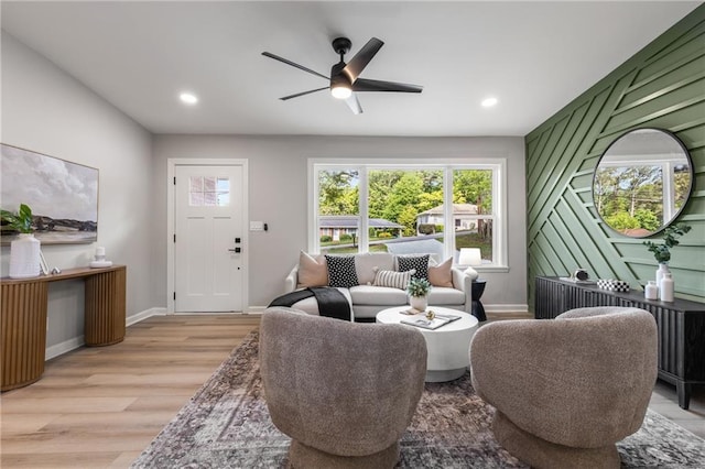 living area featuring light wood-type flooring, recessed lighting, baseboards, and ceiling fan