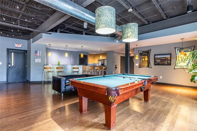 5300 Peachtree Rd Unit 3206, Atlanta, GA 30341 - game room featuring baseboards, a high ceiling, and wood finished floors