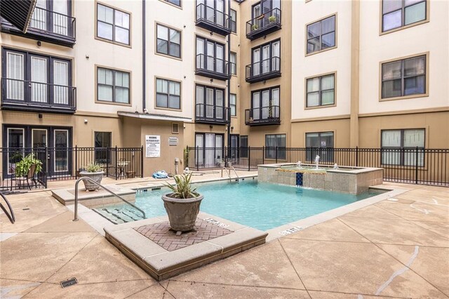 5300 Peachtree Rd Unit 3206, Atlanta, GA 30341 - community pool with a patio area, fence, and a community hot tub