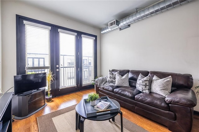 5300 Peachtree Rd Unit 3206, Atlanta, GA 30341 - living room with french doors, wood finished floors, and visible vents