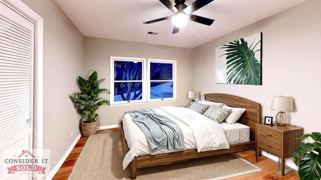 137 Rockville Springs Ct, Eatonton, GA 31024 - bedroom with a ceiling fan, baseboards, visible vents, and wood finished floors