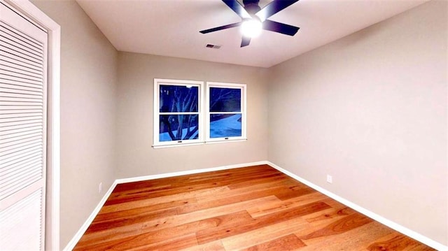 137 Rockville Springs Ct, Eatonton, GA 31024 - spare room featuring baseboards, a ceiling fan, wood finished floors, and visible vents