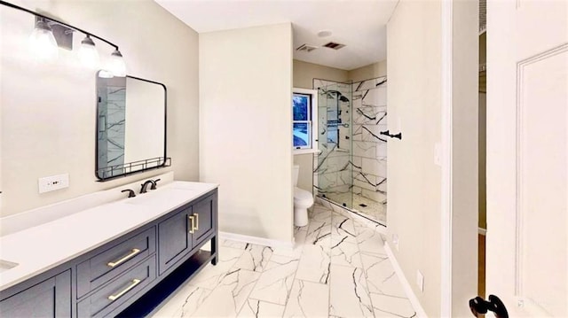 137 Rockville Springs Ct, Eatonton, GA 31024 - bathroom with double vanity, marble finish floor, toilet, a sink, and a stall shower