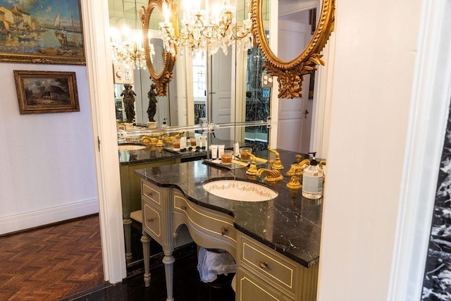 bathroom featuring baseboards and vanity