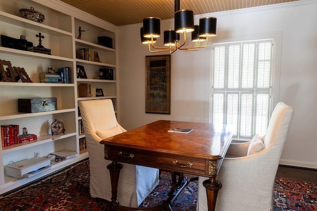 office space featuring ornamental molding and a notable chandelier