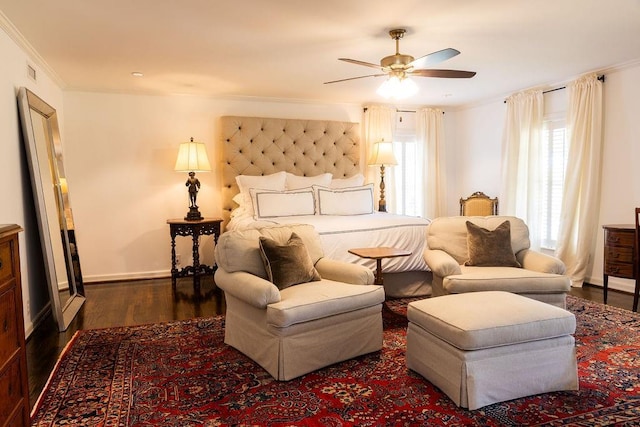 bedroom featuring baseboards, ceiling fan, wood finished floors, and crown molding